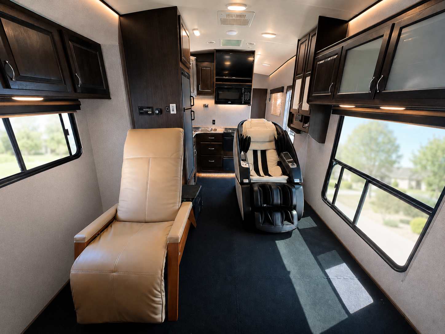 Front interior of the lounge with a leather recliner and massage chair